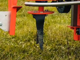 Power Harrow working between vines
